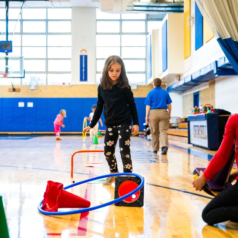 Lower School student participating in physical activities at Churchill School.